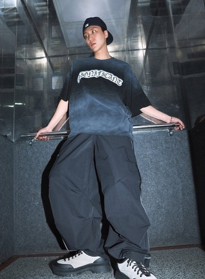 men-s-cargo-balloon-fit-windbreaker-pants-black-iu503