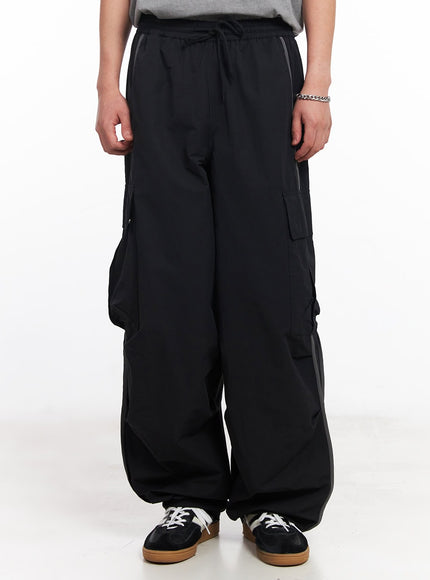 men-s-cargo-balloon-fit-windbreaker-pants-black-iu503