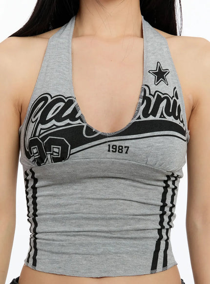 padded-graphic-print-halter-top-im513