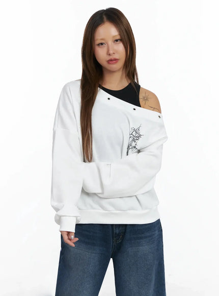 off-shoulder-eyelet-graphic-sweater-in528