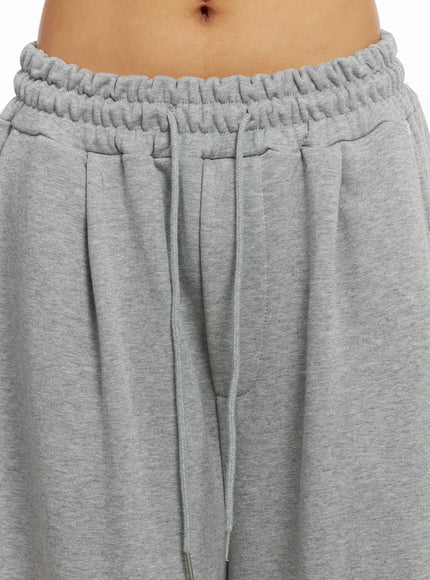studded-cross-baggy-sweatpants-iy501