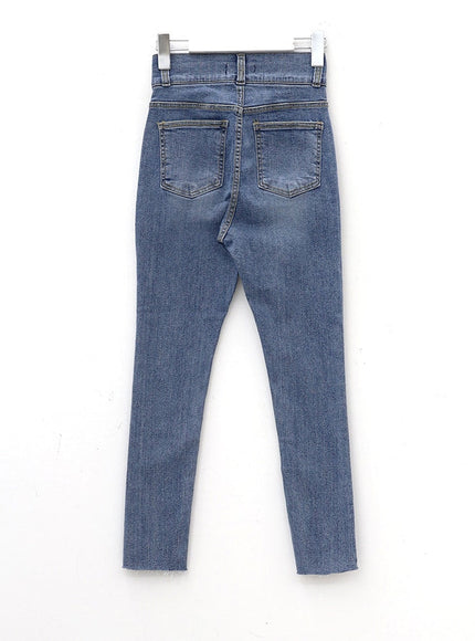Double Button Raw Hem Skinny Jeans IA11